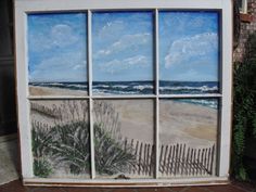 an image of a beach scene painted on a window