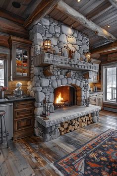 a stone fireplace in the middle of a kitchen with wood floors and cabinets on either side