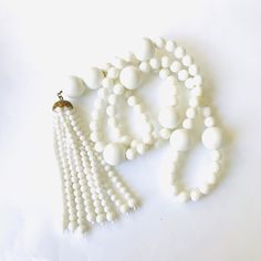 Vintage White Plastic Tassel Necklace - slip this over your head and make a statement! Necklace is 32 inches plus a 6 inch pendant/tassel bring it to 38inches See additional photo's. *The age/description of materials of this pin is an estimate based on internet searches. I am usually in the pursuit of vintage beads for my other shop where I make and sell upcycled jewelry designs. I have always collected brooches and have decided to sell some of my collection. Please use Etsy conversations for in Vintage Beads, Upcycled Jewelry, White Necklace, Crown Jewels, Necklace Vintage, My Collection, Jewelry Designs, Make And Sell, Vintage Necklace