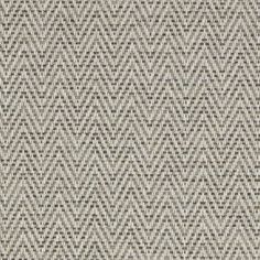 an upholstered gray and white fabric textured with small squares on the surface