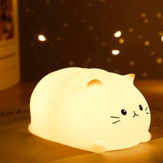 a cat shaped light sitting on top of a table