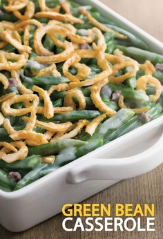 a casserole dish filled with green beans and onions