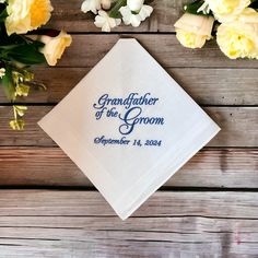 The handkerchief will read Grandfather of the Groom and the wedding date. The digitized example lettering is shown in medium grey.  The handkerchief is a traditional men's white handkerchief with a satin band and a hand rolled hem, measuring 16" by 16". The product is made in a smoke free home. White Wedding Handkerchiefs With Custom Embroidery, White Handkerchiefs With Custom Embroidery For Wedding, Custom Text White Handkerchiefs For Wedding, White Custom Text Handkerchiefs For Wedding, White Handkerchiefs With Custom Text For Wedding, White Embroidered Text Handkerchief Wedding Gift, Customizable White Handkerchiefs For Anniversary, Classic Wedding Handkerchiefs For Father's Day, Wedding Hankerchief