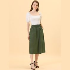 Remember the good times in this cotton A-line midi skirt.Simple and delicate, this skirt features elastic waist, slash pocket, solid color, cotton fabric, A-line, and midi length. From Monday to Sunday, this skirt is effortless to throw on. With the design of elastic waist, this skirt is easy to wear for all kinds of body shapes. Pair perfectly with a T-shirt or shirt for a stylish look. Spring Cotton Maxi Skirt With Pockets, Cotton Maxi Skirt With Pockets For Spring, Spring Maxi Skirt With Pockets For Daywear, Cotton Midi Length Bottoms For Summer, Spring Midi Skirt With Pockets, Cotton Midi Skirt For Daywear, Daywear Cotton Midi Skirt, Knee-length Cotton Maxi Skirt For Summer, Green Cotton Midi Skirt