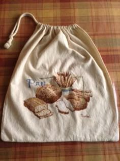 a drawstring bag with some bread on it