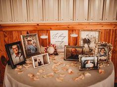 a table with pictures and flowers on it