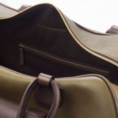 Luxury Brown Duffle Bag With Smooth Grain, Luxury Brown Duffle Bag With Adjustable Strap, Luxury Beige Tote Duffle Bag, Luxury Leather Trim Duffle Bag, Luxury Duffle Bag With Leather Trim For Daily Use, Luxury Leather Handles Duffle Bag For Weekend Trips, Luxury Tote Duffle Bag With Top Carry Handle, Luxury Leather Chic Duffle Bag, Luxury Chic Duffle Bag With Large Capacity