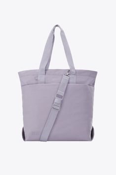 Discover our new utility tote bag in lavender. Perfect for work, travel, or everyday use, shop now for a durable travel tote bag designed to meet all your needs. Eco-friendly Bags With Top Carry Handle For On-the-go, Versatile Canvas Tote Bag With Adjustable Strap, Everyday Large Capacity Canvas Shoulder Bag, Large Capacity Canvas Shoulder Bag For Daily Use, Practical Everyday Bag With Top Carry Handle, Practical Everyday Shoulder Bag, Everyday Large Canvas Shoulder Bag, Large Capacity Cotton Backpack, Canvas Tote Shoulder Bag With Adjustable Straps