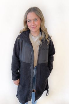 Get ready to stay warm and stylish this winter with our Chrissy Sherpa Jacket! With a longline design, plush micro fleece interior, and cinch ties at the hem, this jacket is perfect for chilly days. It also features a high neck, woven yoke panel, hand pockets, and a zippered chest pocket. Don't let the cold weather stop you, grab your go-to jacket now!