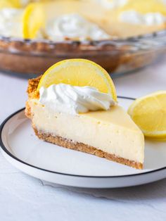 a slice of lemon pie on a white plate with the words creamy lemon pie above it