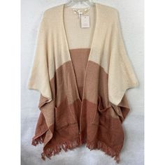 Elevate Your Winter Wardrobe With This Stunning Lauren Conrad Poncho Shawl. The Slouchy, Relaxed Fit Of This Cardigan-Style Sweater Is Perfect For Any Occasion, Whether You're Running Errands, Traveling, Or Working. The Multicolor Acrylic Material Is Lightweight, Soft, And Machine Washable For Easy Care. Featuring Tasseled And Fringe Accents, This Sweater Has A Bohemian, Hippie, And Western Theme, Making It A Versatile Addition To Any Outfit. The V-Neckline And Short Sleeves Provide A Classic To Cozy Fall Poncho For Beach, Casual Fall Poncho For The Beach, Casual Fall Beach Poncho, Brown Poncho For Layering, One Size, One-size Batwing Sleeve Sweater For Layering, One Size Batwing Sleeve Sweater For Layering, Beige Knit Poncho One Size, Beige Knit Poncho, One-size Beige Knit Poncho