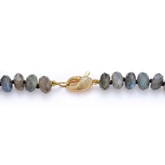 Faceted labradorite culminates with a cheeky crab claw clasp. Labradorite is a stone of transformation. Associated with the throat chakra, it can connect a person with the divine and help discover their true self. Also known as a protector stone, labradorite is believed to shield against misfortunes. Made to order. Adjustable Labradorite Gemstone Beaded Necklaces, Spiritual Single Strand Oval Bead Jewelry, Spiritual Single Strand Jewelry With Oval Beads, Adjustable Labradorite Gemstone Bead Necklace, Spiritual Moonstone Rondelle Jewelry, Artisan Necklace With Natural Stones And Labradorite, Labradorite Gemstone Beads Necklace For Meditation, Rondelle Moonstone Gemstone Jewelry, Moonstone Rondelle Gemstone Jewelry