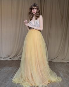 This a fancy tulle wedding skirt with a long train, elegant and airy. The skirt consists of several layers of mustard silk, pale gold chiffon, and marigold tulle. It is fastened on the back with a concealed zipper. If you want to change any detail in the style of the wedding skirt, just email us. We will discuss everything and make a custom skirt for you. All our skirt are made to order, so please allow 1 - 2 weeks for production. This time rate doesn't include the shipping time. Rush orders: Pl Top And Skirt Wedding Dress, Wedding Dress Coat, Marigold Wedding, Silk Bridal Gown, Embroidered Wedding Gown, Tulle Wedding Skirt, Bridal Skirt, Charming Wedding, Skirt Tulle