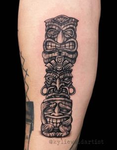 a tattoo on the leg of a man with an image of a totema