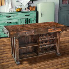 an old fashioned kitchen island in the middle of a room with green cabinets and drawers