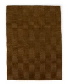 a brown rug on a white background