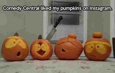 three pumpkins with faces carved into them sitting on a table next to a window