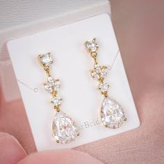 "Very romantic crystal bridal earrings. Gorgeous earrings for your special day! They measure about 1 1/4\" long and 1/4\" wide. High quality guaranteed by GlamourBrideUSA! SHIPPING: Standard Shipping: 4-6 business days Priority mail Shipping: 2-3 business days *INTERNATIONAL ORDERS: PLEASE NOTE CUSTOMERS ARE RESPONSIBLE FOR ALL DUTIES & TAXES*" Gold Teardrop Linear Earrings For Weddings, Crystal Dangle Earrings For Wedding, Gold Cubic Zirconia Bridal Earrings For Bridesmaids, Rose Gold Drop Crystal Earrings For Wedding, Rose Gold Long Drop Earrings For Wedding, Crystal Linear Earrings For Wedding, Wedding Long Drop Linear Earrings In Cubic Zirconia, Long Drop Crystal Earrings For Wedding, Rose Gold Dangle Linear Earrings For Wedding