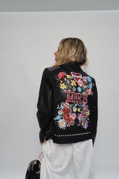 The ULTIMATE jacket for all punk rocker brides out there. Taking over 12 hours to produce using advanced digital embroidery techniques with hand studded details to finish. This exclusive Beth Wilson Bespoke Embroidery jacket includes 25 thread colours, 4 appliqué patches and over 268,000 stitches. Full design measures 28.5cm W x 41cm H, will be adapted to best compliment jacket size. Model is a UK 6 and wears a UK 14. ❤️ LOVE this design but it's not on the correct size or style of jacket for yo Embroidery Jacket, Alternative Bride, Wedding Jacket, Punk Rocker, Jacket Denim, Faux Leather Jacket, Bride Style, Black Leather Jacket, Embroidery Techniques