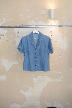 Vintage 90s denim short sleeve buttons down blouse Sizer: XS ( fits to smaller sizes as oversized ) / Regular fit 100% cotton made *VINTAGE CONDITION: 9/10 -> FLAT MEASUREMENTS (cm/in): -shoulder to shoulder: 42cm / 15.5in -chest: 45m / 16.5in -sleeve: 30cm / 11.5in -total length: 65cm / 25.5in   -> You have 14d return window >Shipping Cost National (Greece):  2.5€ with ELTA COURIER Europe : 7.5€ tracked DHL ( 5 to 6 b-days delivery time) NEXT DAY DELIVERY: 15.5€ DHL express  USA/CANADA: 13.4$ t Summer Washed Button-up Shirt, Washed Blue Relaxed Fit Denim Top With Short Sleeves, Collared Denim Shirt For Summer, Summer Collared Denim Shirt, Summer Denim Collared Shirt, Summer Everyday Washed Denim Jacket, Washed Blue Button-up Shirt For Summer, Summer Washed Blue Button-up Shirt, Short Sleeve Medium Wash Denim Jacket