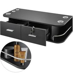 a black shelf with two drawers and some items in front of the bottom one is open