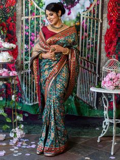 You will be the center of attention in this breathtaking paithani silk saree which comes with intricate reshim and gold weaving. Saree has beautiful flowery designs This beautiful paithani has stitched blouse. Size - 34-42 Color - Royal Green Fabric & Work Style - - Paithani Silk Saree - Embellishments at the border of saree with flowers. Details - - Assured quality. - Wash care instruction: Dry clean only. - Slight variation in color is possible due to digital photography. Multicolor Paithani Silk Pre-draped Saree For Navratri, Chanderi Meenakari Pre-draped Saree For Navratri, Festive Pre-draped Saree In Paithani Silk With Traditional Patterns, Diwali Meenakari Pre-draped Saree In Dola Silk, Festival Paithani Silk Pre-draped Saree With Cutdana, Festival Paithani Silk Pre-draped Saree With Zari Work, Paithani Silk Pre-draped Saree For Traditional Ceremonies, Traditional Pre-draped Paithani Silk Saree, Navratri Katan Silk Pre-draped Saree With Meenakari