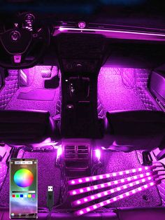 the interior of a car is lit up with purple lights and wifi connected to an appliance