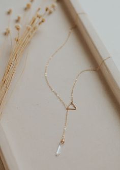 Our first clasp-less necklace! We're into it, and we know you will be too! Simply slide the stunning stone pendant through the triangle charm and adjust to your liking. Necklace measures 18". Stones range from 13mm-19mm long.  Available in 14kt Gold Fill + Sterling Silver. Double loop the chain through triangle piece t Y Shaped Necklace, Gold Necklace With Pendant, Jewelry Mood Board, Twist Earrings, Choker Handmade, The Triangle, Jewelry Lookbook, Fantasy Jewelry, Lariat Necklace