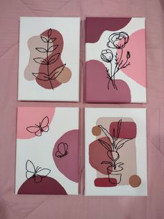 four square paintings with flowers on them in pinks and browns, one is white