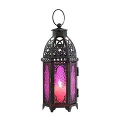 a purple and black lantern with a pink light in the middle, on a white background