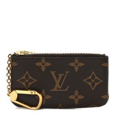 This is an authentic LOUIS VUITTON Monogram Key Pouch. This pouch is crafted of Louis Vuitton monogram toile canvas in brown. The top zipper opens top a brown, cross-grain leather interior with an attached carabiner that can be clipped to your keys or handbag. Louis Vuitton Pouch, Key Pouch, Leather Interior, Authentic Louis Vuitton, Louis Vuitton Monogram, The Top, Grain, Louis Vuitton, Pouch