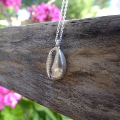 "Sterling silver small cowry pendant. It is a copy from a real seashell.The method I followed to make it is the lost wax casting. This pendant is a piece of the \"Water\" collection. MATERIALS  Seashell : Sterling silver (.925) Chain : Sterling silver (.925) with spring ring clasp MEASUREMENTS Seashell : 13 x 9 mm (0,51\" x 0,35\")  Chain :  40 cm (15,748\") long (from end to end)                 for different length send me a message. I send all my jewellery gift wrapped inside a bubble envelope. For questions, custom orders or more information please send me a message." Silver Shell With Pearl Pendant, Silver Shell Necklace With Pearl Pendant, Handmade Silver Shell Pendant, Handmade Silver Pendant Shell, Handmade Silver Shell As A Gift, Silver Sterling Silver Shell Pendant Necklace, Silver Sterling Silver Pendant Shell Necklace, Unique Silver Shell Necklace For Beach, Ocean-inspired Silver Shell Necklace