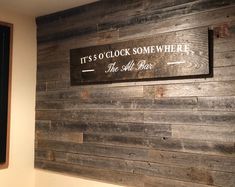 there is a sign on the wall that says it's o'clock somewhere