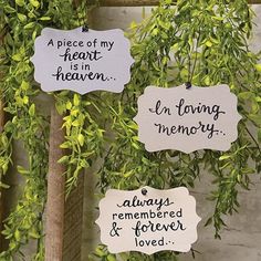 three hanging signs that say i'm loving memory, always remembers and forever loved