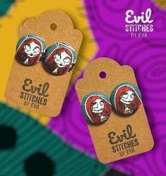 two small buttons with the words evil stitches on them