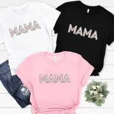 Personalised  Floral Mama T-shirt, Mama Tshirt, Bespoke Mothers Day, New Mum Shirt, First Mothers Day Tee, Mom top. Personalized gift. This listing is for a high quality bespoke Mum T-shirt that is a hand made item, made to order. Our Mama tshirt is handmade with the finest machinery ensuring the ultimate quality for you. Using only premium  tees, your handmade T Shirt will be SUPER soft and SUPER comfy Material: Luxuriously 100% Cotton, Breathable, and super Soft Material Handmade Quality: Crafted with the finest machinery for unmatched quality. Design Options: Choose between printed or blank styles. How to Order ❤️ Select the colour and size of Tshirt you require ❤️ Select Printed or Unprinted / Blank Sizing Guide These T Shirts are a Unisex size so we recommend that you measure and comp Mother's Day Graphic Tee With Text Print, Cotton T-shirt With Letter Print For Mother's Day, Mother's Day Screen Print Crew Neck T-shirt, Graphic Tee Tops For Mother's Day Birthday, Mother's Day Pink Graphic Tee, Trendy Tops With Funny Text For Mother's Day, Pink Graphic Print T-shirt For Mother's Day, Cotton Graphic Tee As A Gift, Mother's Day Screen Print Crew Neck Top