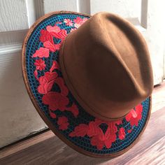 Stand out with this beautiful handcrafted Mexican Suede Hat with beautiful detailed floral embroidered canvas brim. Perfect accessory to add that with that daily outfit. MADE IN MEXICO By: Mexican Artisans For: Women Size: Medium 23' Color: brown | blue | red Details: Top Suede Embroidered canvas brim Inner elastic band Contact us for more details PLEASE READ BEFORE PURCHASE: The picture is an ACCURATE REPRESENTATION.Colors in the pictures may vary a little by effects of light. Each product is h Embroidered Brown Cap, Bohemian Red Brimmed Hat, Brown Embroidered Hat, One Size, Red Bohemian Hat For Kentucky Derby, Bohemian Red Hats For Kentucky Derby, Spring Festival Embroidered Hat, Bohemian Red Hat For Kentucky Derby, Embroidered Brimmed Spring Hats, Red Bohemian Wide Brim Felt Hat