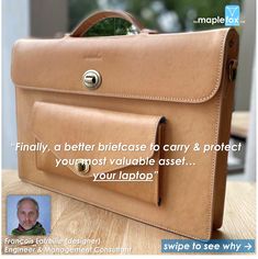 a brown briefcase sitting on top of a wooden table