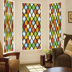 a living room with stained glass windows and furniture in it's centerpieces