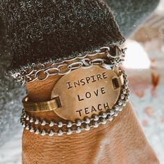 We have restocked our brass cuff/bracelets. They are hand stamped, and are just great They make the perfect gift.  This one is Inspire Love Teach Hand Stamped Cuff Bracelet, Metal Stamped Jewelry, Brass Cuff Bracelet, Seal Beach, Brass Cuff, Stamped Jewelry, Tiffany Heart, Pretty Jewellery, Heart Charm Bracelet