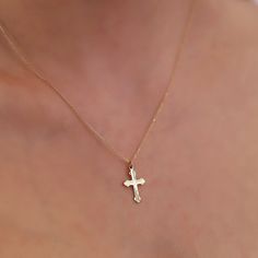 The dainty Cross Necklace, skillfully crafted in 14K Gold, is a refined and stylish accessory that brings an element of elegance to any outfit. It boasts a delicate cross pendant gracefully hanging from a fine gold chain, making it suitable for both everyday wear and special occasions. The use of 14k gold ensures not only durability but also a enduring radiance. Here are the essential details: Artisanally made from 14k solid gold All materials are responsibly sourced from the United States Size Dainty Cross Necklace, Chain Making, Small Crosses, Christian Jewelry, Cross Pendant Necklace, Custom Necklace, Stylish Accessories, Real Gold, Chain Styles