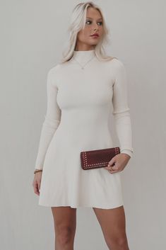 Oh yeah we can see it. See ourselves with an iced coffee in this beautiful flattering mini dress. High neck cream fit and flare long sleeve mini dress, lightweight sweater material, not lined Material is Polyester Hang to dry Model is 5'7 wearing a small SHOP THE LOOK Small Medium Large Length 32" 33" 34" Bust 9" 10" 11" Wedding Guest Romper, Cream Sweater Dress, Party Bottoms, White Sweater Dress, Dress High Neck, Flare Long Sleeve, Neck Cream, Amazing Lace, Eclectic Fashion