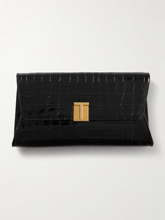 TOM FORD's 'Nobile' clutch will serve as an elegant final touch to evening looks. Crafted from croc-effect patent-leather, it's embellished with the label's gold-tone 'T' hardware and has a matching chain strap. Stow your cardholder, keys and a lipstick inside. Tom Ford Purse, Tom Ford Women, Tom Ford Bag, Luxury Clutch, Baggage Claim, Flat Dress Shoes, Bag Belt, Designer Clutch, Black Clutch