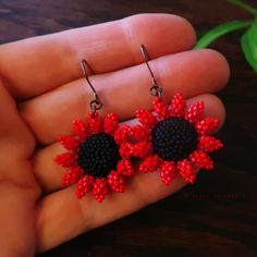 Heart in Hawaii Mini Beaded Sunflower Earrings - Red and Matte Black Handmade Red Flower Beaded Earrings, Red Flower-shaped Beads For Gifts, Adjustable Red Flower Beaded Earrings, Black Flower-shaped Jewelry With Colorful Beads, Handmade Red Flower Jewelry, Adjustable Red Beaded Earrings With Black Beads, Handmade Red Beads For Crafting, Traditional Black Jewelry With Bead Caps, Red Tiny Beads For Crafting