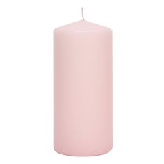 a pink pillar candle on a white background