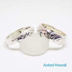 Custom order and Hand made in the Aloha StateHand engraved with Old English design - Hawaiian Maile, Plumeria, and Ocean wave.Made with sterling silver. Ring width is selectable from 4mm to 12mm, Thickness is 2mm.Picture shown above has width of 4mm and 6mm.Ring is perfect for people with an active life style, also great gift for anniversary, wedding or any special occasion. *Free inside message engraving. To make the piece more personal, you can add a special message on the inside of the ring, Traditional Carved Engraved Wedding Ring, Classic Carved Engraved Ring For Anniversary, Carved Sterling Silver Rings For Anniversary, Sterling Silver Carved Promise Ring, Adjustable Carved Silver Ring, Traditional Rings With Engraving Option For Anniversary, Anniversary Carved Sterling Silver Ring, Anniversary Sterling Silver Carved Rings, White Gold Sterling Silver Wedding Ring With Engraving Option