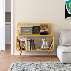 a living room with a couch and book shelf