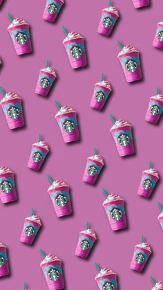 pink starbucks cups with green straws on a purple and blue background that is very similar to the starbucks logo