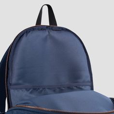 This Levi's backpack is signature style designed with everyday function in mind. It's made of durable denim containing sustainably sourced cotton and lined with lightweight poly to reinforce the integrity of the bag. The zippered main compartment is spacious enough to hold what you need for the day and the zippered back compartment is padded, and can be used to hold your laptop or tablet. Use the bottle pocket on the side to hold your beverage and the zippered pocket on the front to help secure Denim Blue Standard Backpack For Travel, Casual Canvas Backpack With Zipper Pocket, Denim Blue Travel Backpack, Casual Denim Blue Standard Backpack, Denim Blue Standard Backpack With Zipper, Denim Blue Backpack With Zipper For Daily Use, Denim Blue Backpack For Everyday And Back To School, Denim Blue Backpack For Travel, Denim Blue Travel Backpack With Zipper Closure