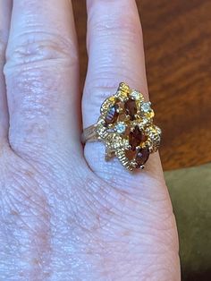 Mid-Century Citrine and Rhinestone  Size 6  18K H.G.E Ring - MOD This gorgeous eye-catching collectible ring is perfect for any occasion, it will delight you every time you wear it! It will make a wonderful addition to your collection or an excellent gift!  The size 6 is on the smaller size of the 6 just ever so slightly. This very detailed and unique piece is in excellent preowned vintage condition. Please review photos for all details, they are part of the description.  Smoke-free home.  Comes Antique Gold Cluster Ring With Gemstones, Victorian Gold Cluster Ring With Gemstone, Vintage Gold Cluster Ring With Gemstones, Estate Gold Ring As Gift, Formal Multi-stone Marquise Ruby Ring, Formal Marquise Multi-stone Ruby Ring, Antique Gold Cluster Ring With Multi-stone, Gold Marquise Ruby Ring With Diamonds, Marquise Cut Multi-stone Yellow Gold Diamond Ring